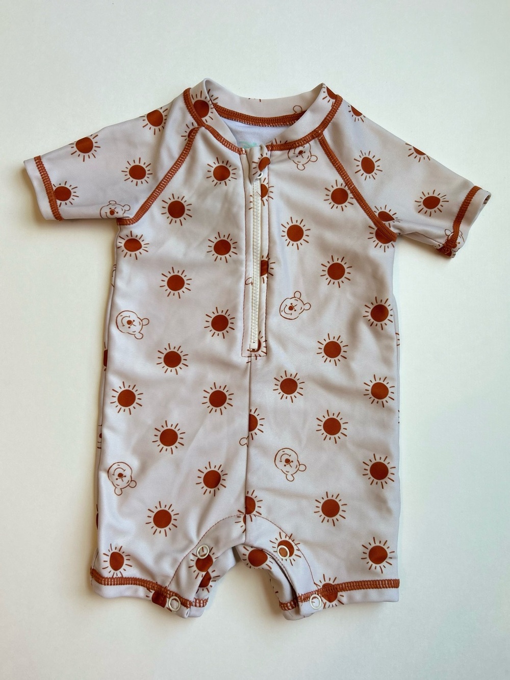 Disney Cream Short Sleeve One-Piece swimsuit with Rust Sun & pooh Print